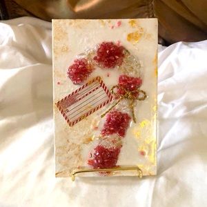 Crushed glass candy cane on canvas.